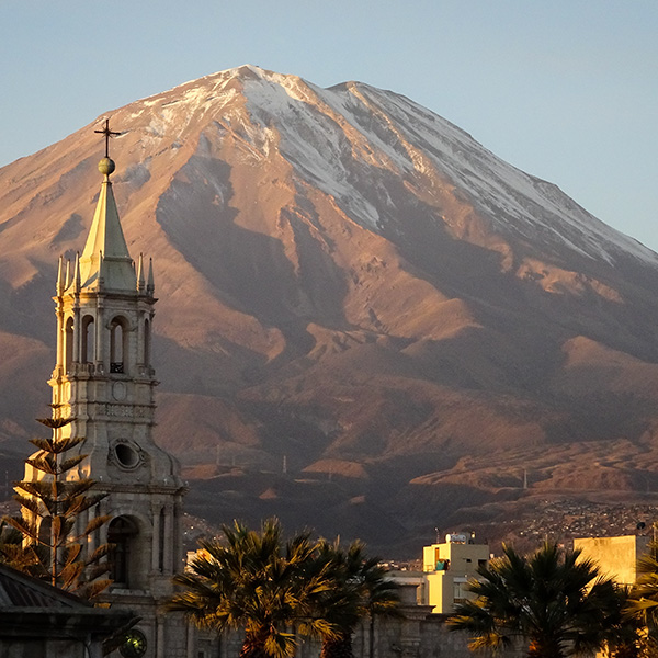 Arequipa city with volcano in the background and church tower
